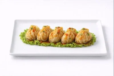 RAVIOLIS AUX SCAMPI MARINÉS À LA SAUCE SPÉCIALE